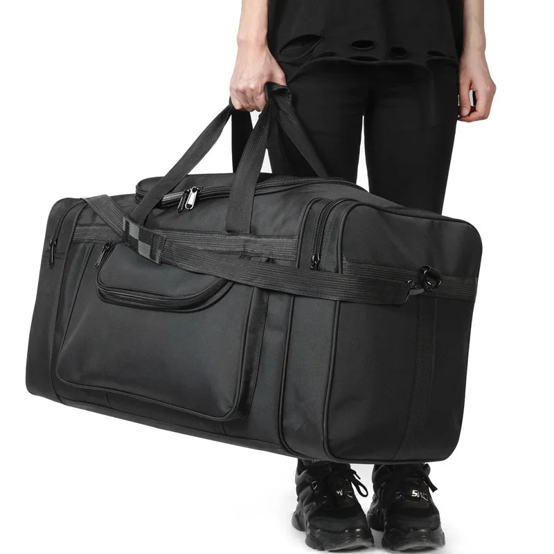 Sac de voyage XXL tenu à la main, vue de face