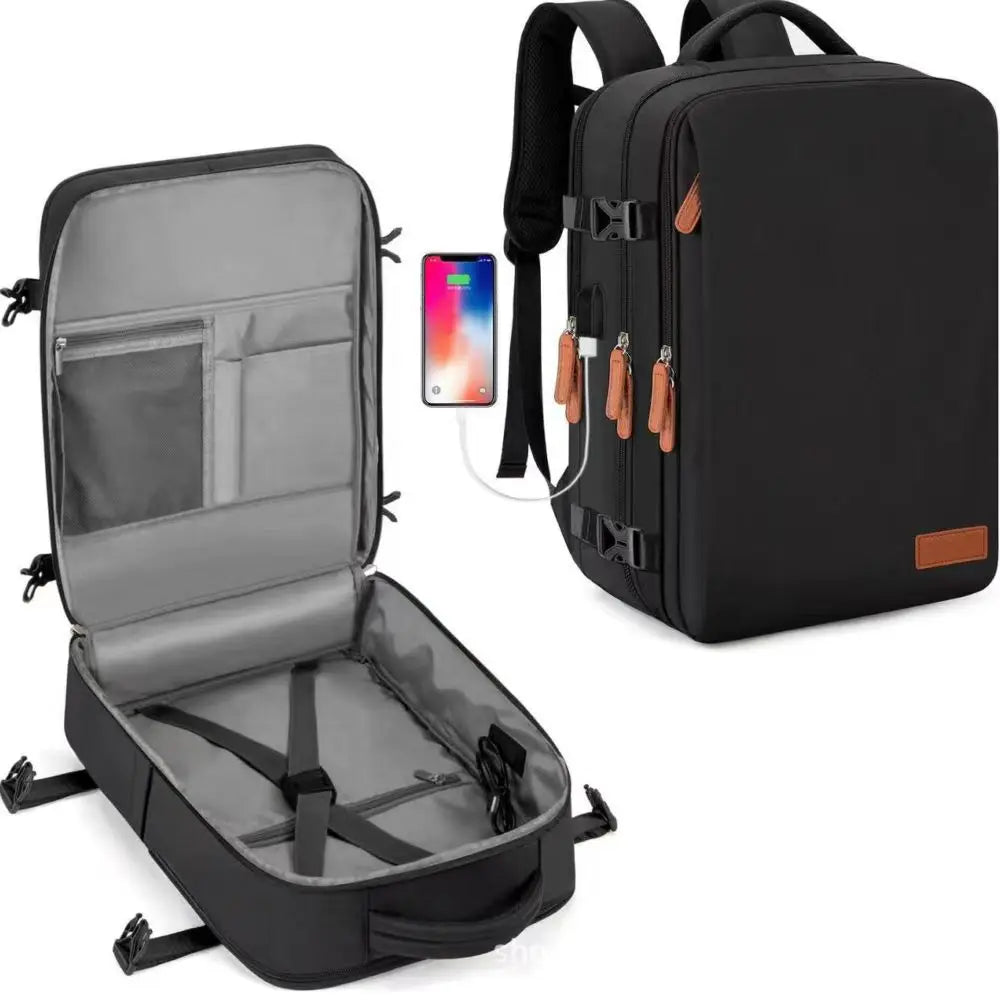 Sac à dos cabine noir ouvert à plat, téléphone branché au port USB