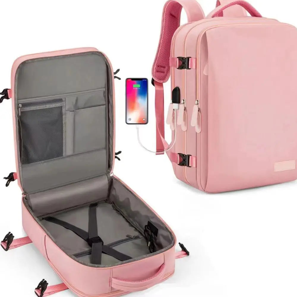 Sac à dos cabine rose ouvert à plat, téléphone branché au port USB