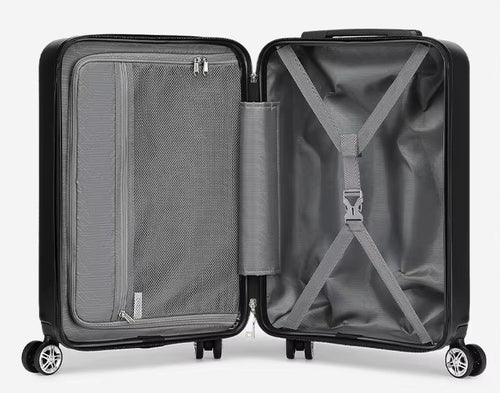 Intérieur de valise rigide noire ouverte : séparateur zippé à poche filet, sangles croisées et roues doubles