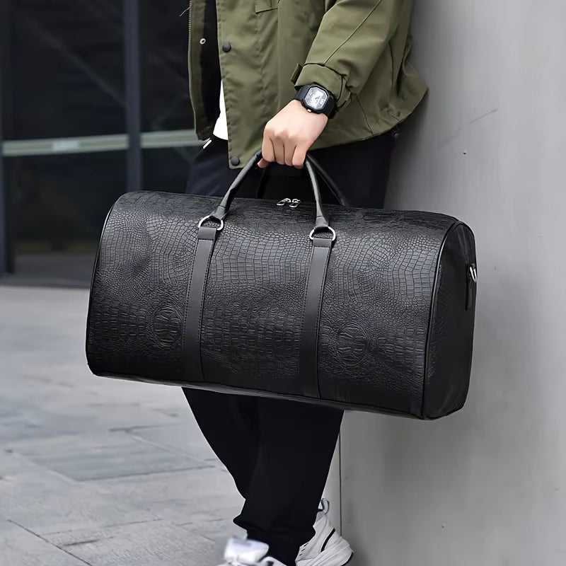 Sac polochon effet croco noir porté à la main, vue de côté