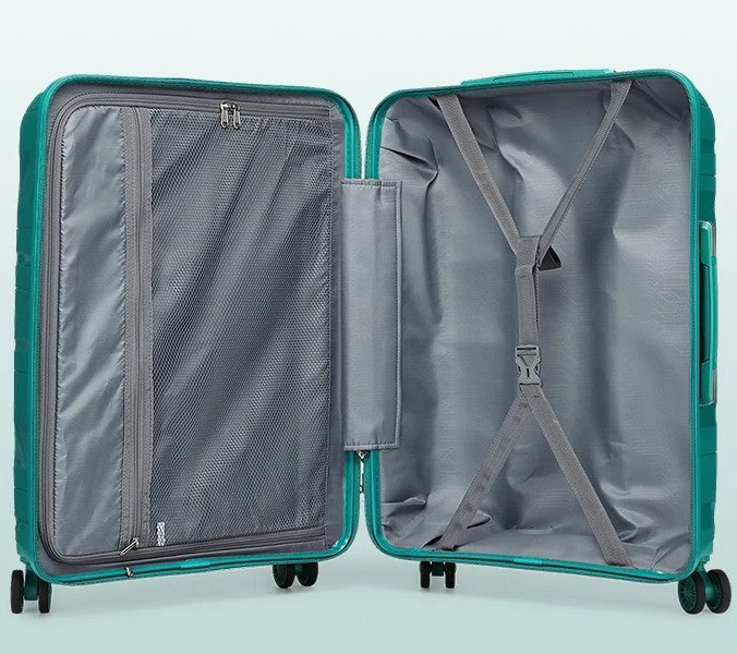 Intérieur de valise en polypropylène vert : doublure grise, poche filet zippée et sangles de maintien croisées
